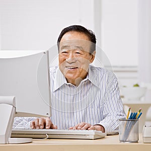 Man typing on computer