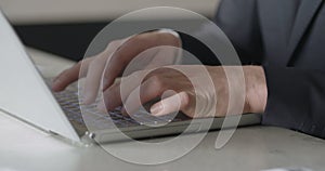 Man typing on computer keyboard