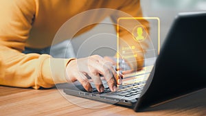 Man typing his user and password on a computer laptop. Cyber security concept to protect data.
