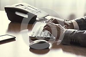 Man typing on keyboard