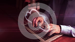 Man typing on keyboard with data cloud hologram