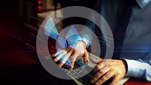 Man typing on keyboard with nuclear energy symbol hologram