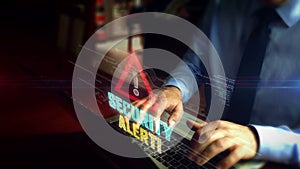 Man typing on keyboard with security alert symbol hologram