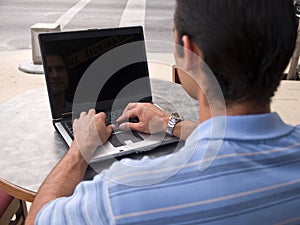 Man typing on laptop