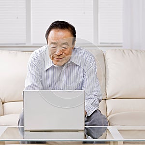 Man typing on laptop