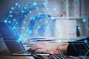 Man typing on laptop, AI brain