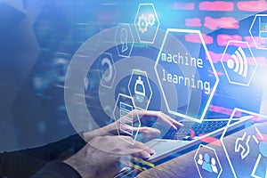 Man typing at laptop, machine learning interface