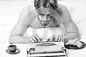 Man typing retro writing machine. Male hands type story or report using vintage typewriter equipment. Writing routine
