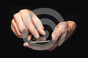 Man typing a text message on a smartphone