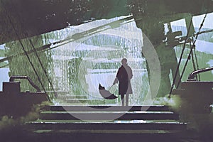 Man with umbrella stands under building in rainy day