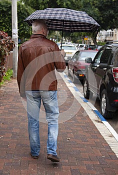 The man with the umbrella on the street