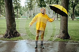 Man with umbrella walking in windy rainy day