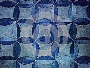 Pattern of blue flowers, forming curved rhombuses, photo