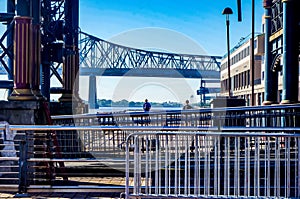 man standing under bridge