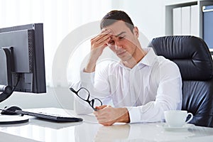 Man under stress with headache and migraine photo