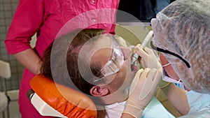 Man undergoing teeth polishing in dental clinic