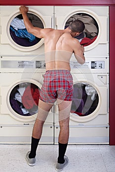 Man in underwear at the dryer