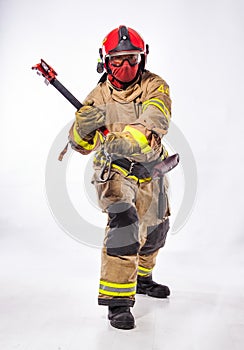 Man in uniform holding fire ax