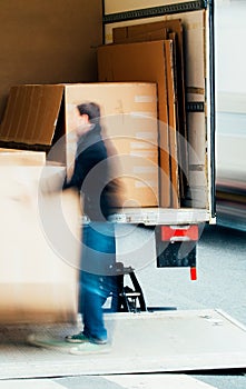 Man unloading boxes from a truck