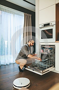 The man unloading dishwasher