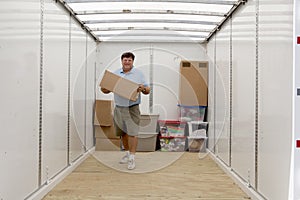 Man unloading portable storage unit photo