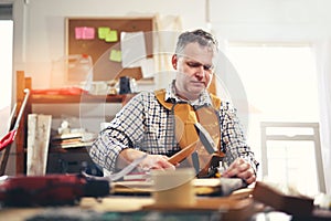 Man upholstering chair