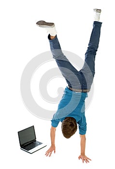 Man upside down using laptop