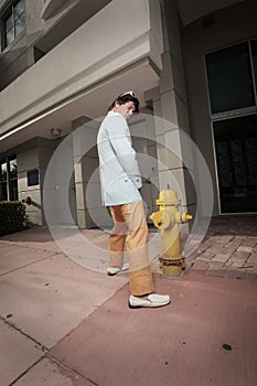 Man urinating on a fire hydrant photo