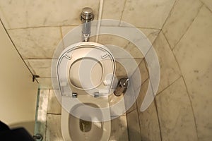 Man urinating in public toilet