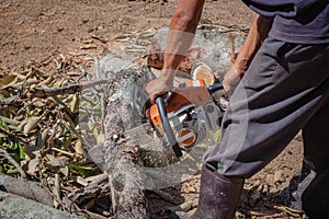 Man is use chainsaw blade cutting
