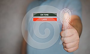 Man use a fingerprint for scan to check in with on time or late. HR concept