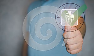 Man use a fingerprint for scan to check in to work. HR concept