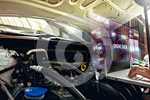 Man use laptop to analysis on his car engine with hologram. the concept of engine service hologram.