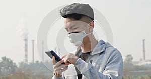 Man use smartphone with mask
