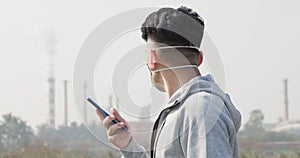 Man use smartphone with mask