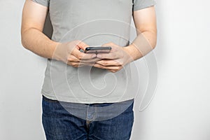 Man uses his Mobile Phone , close up