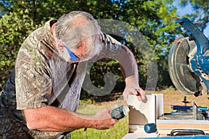 Man Uses a Nail Gun