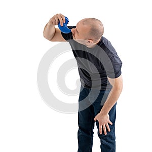 The man uses neti pot. Isolated on a white background. Flushing the nose