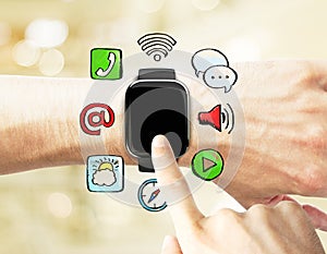 Man uses a smart watch, with social media icons