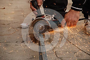 man using an angle grinder