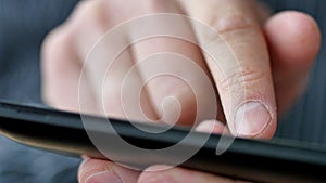 A man using apps on a mobile touchscreen smartphone