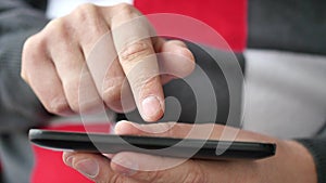 A man using apps on a mobile touchscreen smartphone