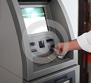 Man using banking machine