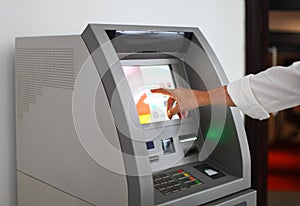 Man using banking machine