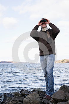 A man using binoculars