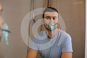 Man using a breathing aid