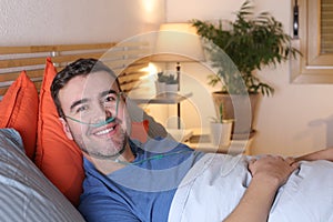 Man using breathing mask in bed