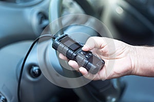 Man using car diagnostic scan tool