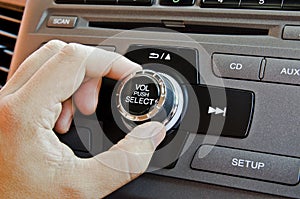 Man using car volume control.