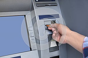 Man using cash machine for money withdrawal